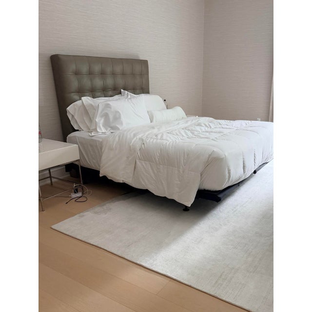 Tall Leather Grid Tufted Headboard, Elephant, Queen Bought in 2014, used for a queen bed, and now we rest it against our...