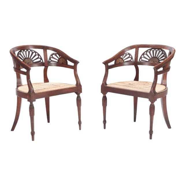 Italian Walnut Open Arm Chairs With Cord Seats and Cut Out Design. Circa 1800. A Pair For Sale