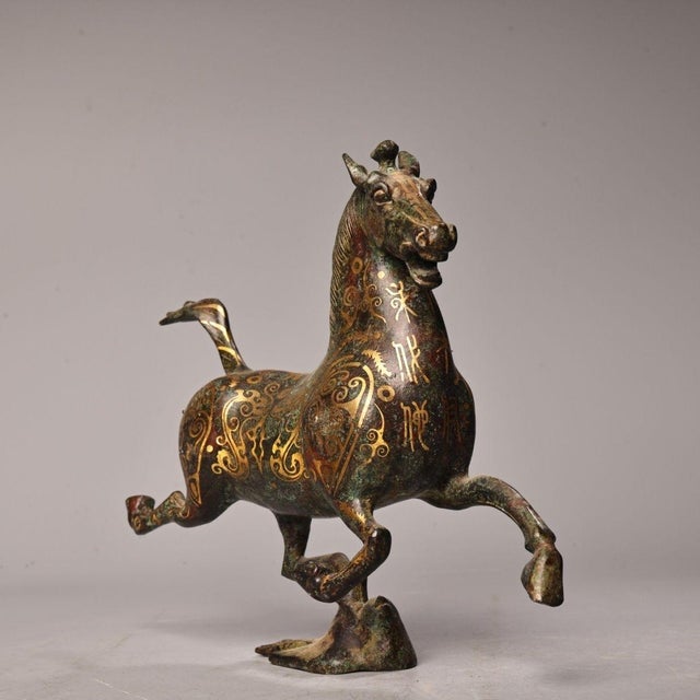 The dynamic galloping horse rests one hoof lightly upon a swallow, symbolizing speed, success and upward momentum. The...