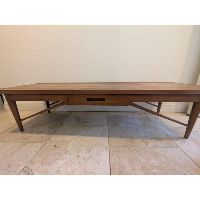 A beautifully proportioned mid-century modern coffee table by Heritage Henredon, from their acclaimed "Modern Design"...