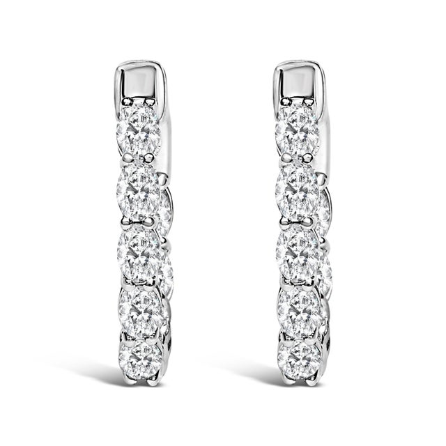 Discover elegance redefined with these exquisite 14K white gold hoop earrings, adorned with 2 3/4 carats of lab-grown...