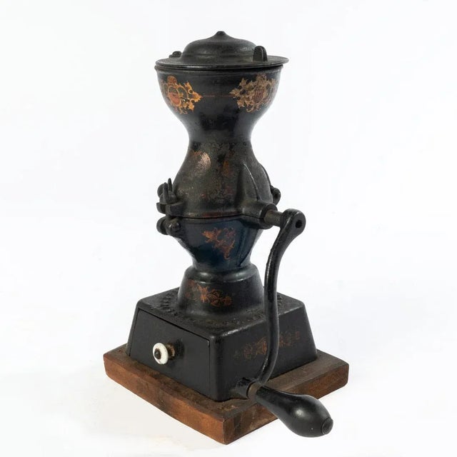 Antique Enterprise No. 1 Coffee Grinder made of cast iron with original decals. The Enterprise Manufacturing Company was...