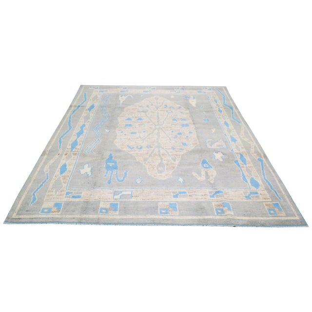 Turkish hand woven Oushak rug with allover design and silky soft texture.