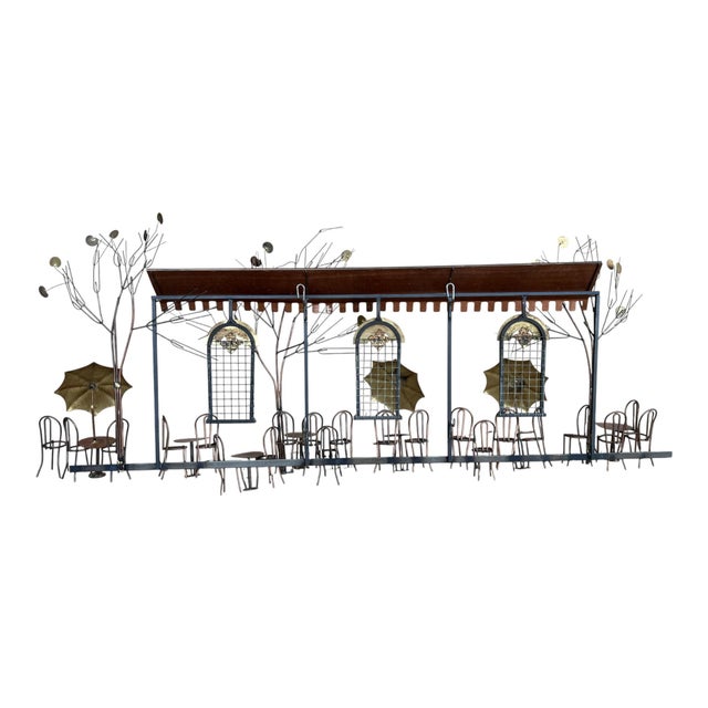 This striking Curtis Jere wall sculpture depicts a whimsical European café street scene, rendered in the iconic mixed-...