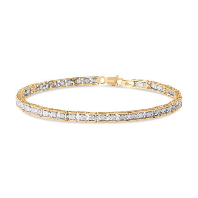 Elegant and timeless, this sterling silver tennis bracelet features 1.0 carat total weight of round, brilliant cut...