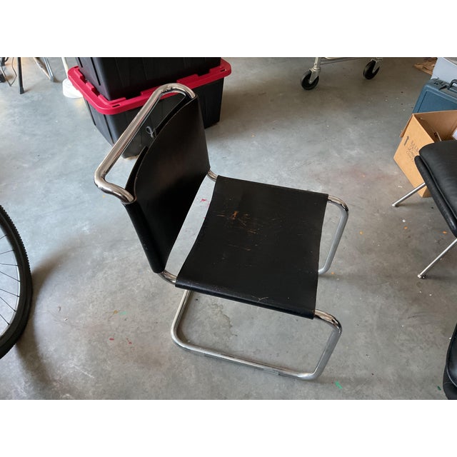 Six vintage leather and chrome laced black thick leather chairs acquired thirty years ago from a Manhattan architect who...