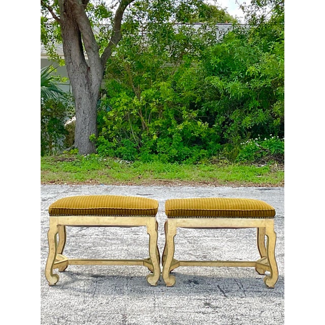 Fantastic vintage pair of corduroy upholstered painted wooden carved ottomans or stools with a fabulous nailhead trim...