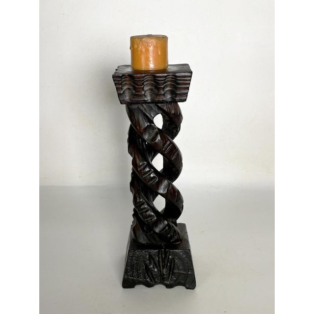 Rustic carved wood candlestick, France, 1970s. An elegant, hand-carved solid wood candlestick featuring a twisted column...