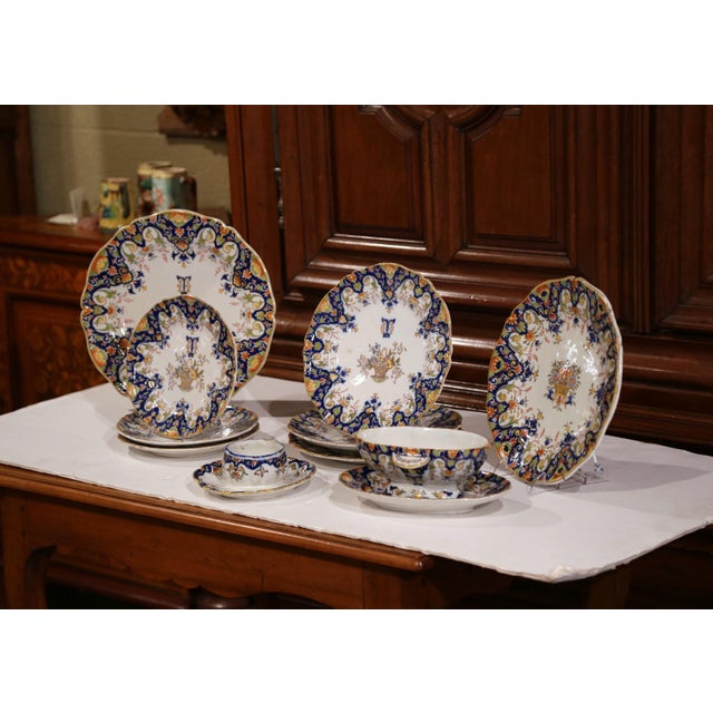 Colorful set of antique wall dishes from Rouen, France; handcrafted, circa 1880, the set includes two large wall hanging...