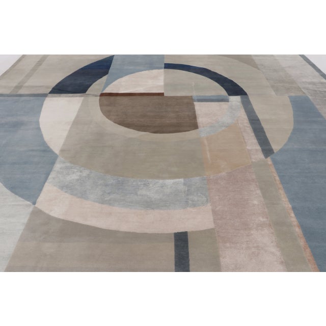 This oversized modern Mid-Century Modern rug from India, measuring 13 x 13, presents a striking geometric composition...