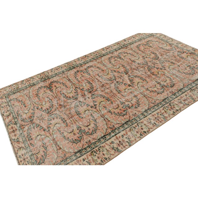 This vintage 5x8 rug, hand-knotted in wool, circa 1960-1970, as inspired by European influences, is a new addition to Rug...