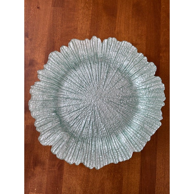 Set of 6 glass chargers in a seafoam/aqua color. Nice weight. A couple do have some minor chipping of the coating as seen...