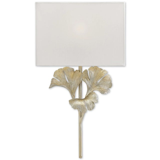 The Gingko Silver Wall Sconce is a botanical-inspired fixture with a distressed silver leaf finish on its wrought iron...