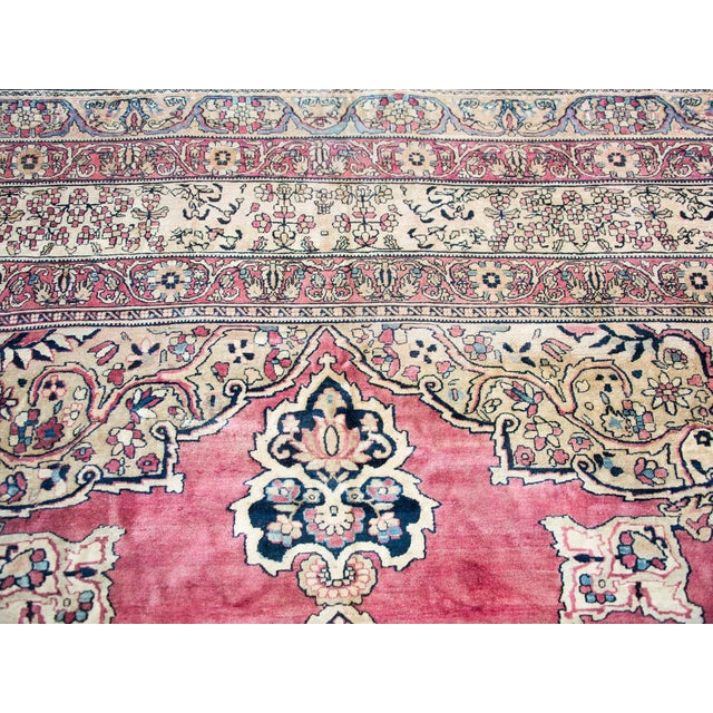 A stunning late 19th century Persian Lavar Kirman rug with the most wonderful central floral medallion woven in...