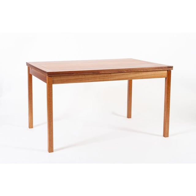 This vintage mid century Danish modern extendable teak dining table was made in Denmark circa 1960. This beautiful table...