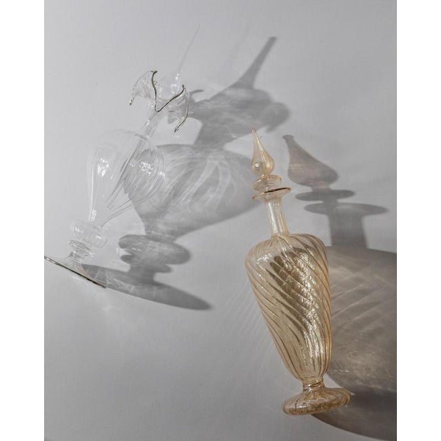 This vintage set of 2 Murano glass perfume bottles from 1940s Italy is a delicate example of hand-blown Venetian artistry....