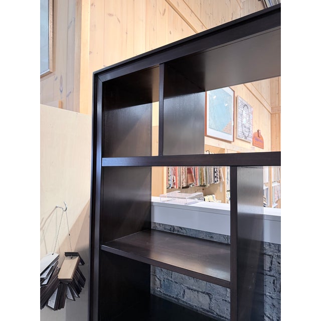 A striking Ethan Allen Curson display bookcase crafted in Indonesia from richly finished mahogany. The architectural open...