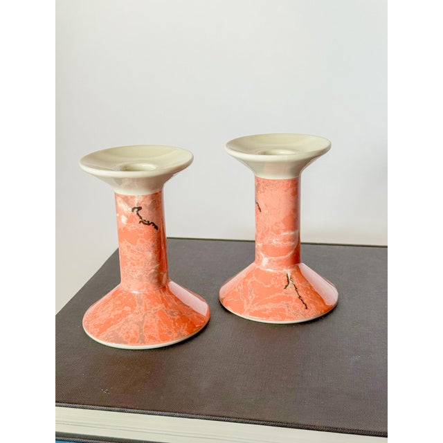 Lovely peach pink marbled porcelain candlestick holders by Villeroy & Boch in their Siena line, evoking the beautiful...