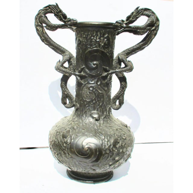 The large and heavy bronze from the early Meiji period Japan. Beautifully textured surface to symbolize wind and storm....