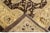 Beautiful oversize Paki Peshawar hand-knotted wool rug with a brown field. This modern rug has gray and golden accents in...