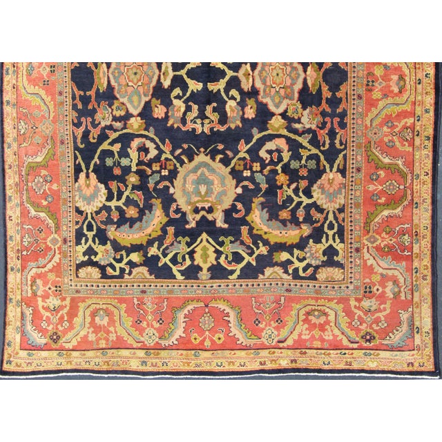 Amazing antique Persian Sultanabad carpet in navy blue background, yellow, citron green and rose red with large scale...