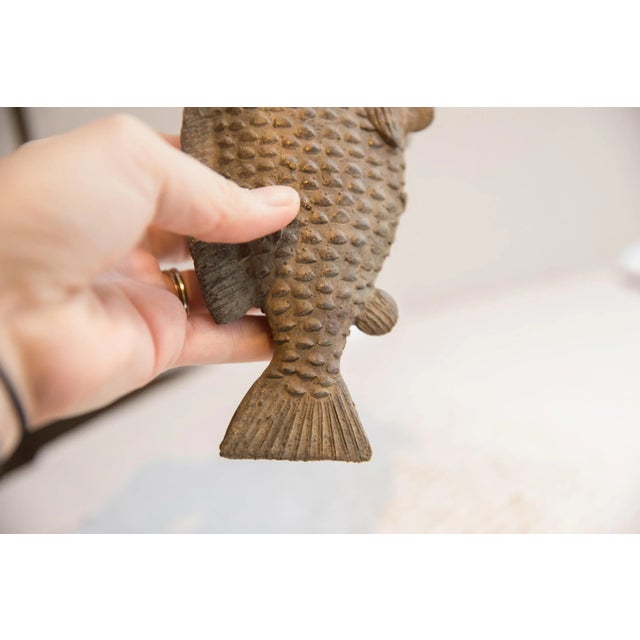 :: Vintage handmade African fish sculpture. Circa late mid 20th century, each figure in this collection represents a...