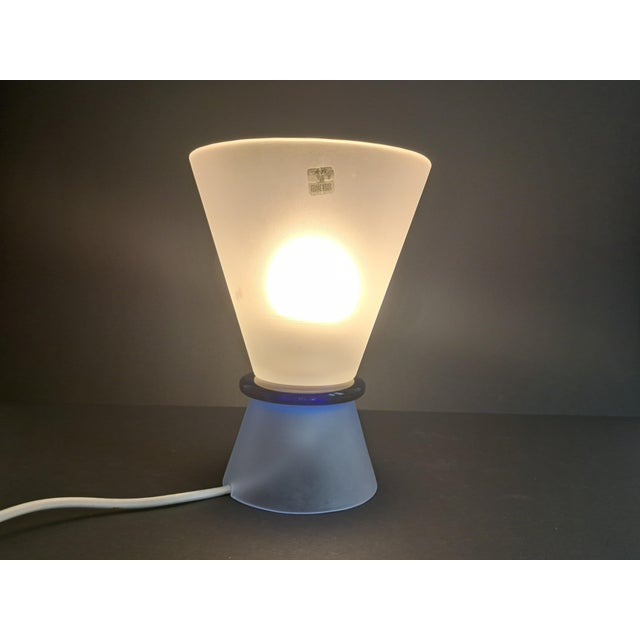 The Murano glass lamp was made by the Effetre glassworks in the 1980s. The style is modern and minimalist. The shape is...