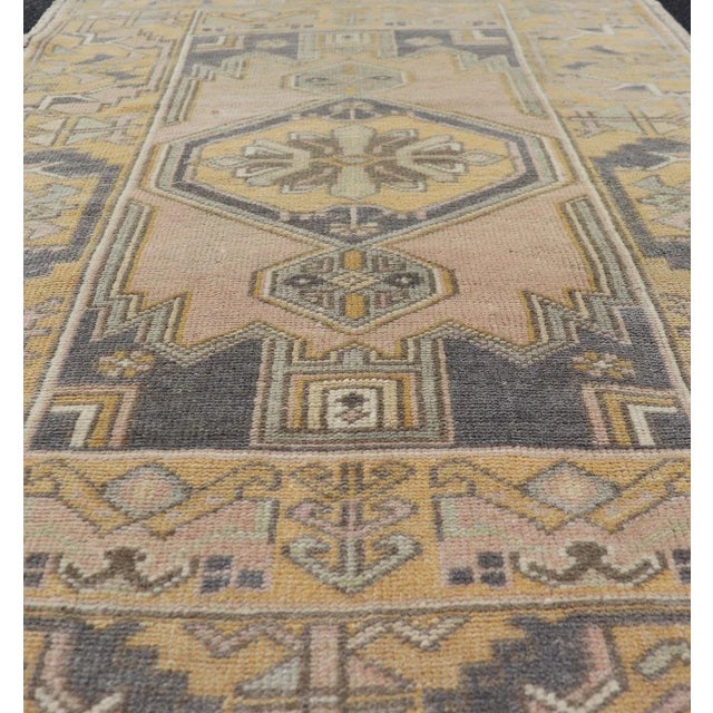 Textile Vintage Oushak Rug From Turkey With Medallion Design in Yellow, Pink, Grey Blue For Sale - Image 7 of 10
