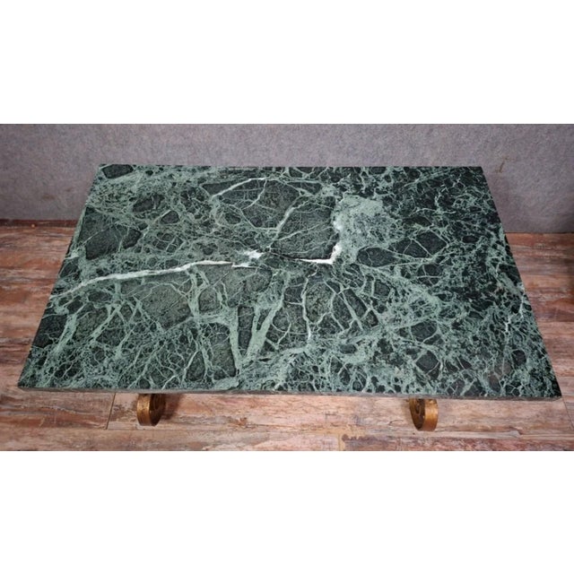 Wrought iron coffee table with scrollwork decoration, in the spirit of 20th-century french designs inspired by...