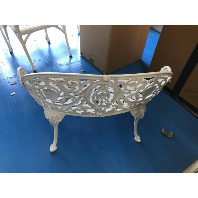 Pretty victorian wrought iron bench painted white. Has been protedted by overhang and rust free. Cute additiion to make a...