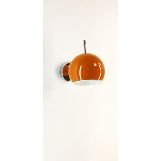 Space Age Adjustable Chrome and Orange Wall Light, in Flawless conditions. Designed 1970 to 1979 Up to 250V (Europe/UK...
