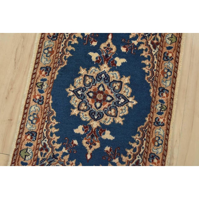 An authentic vintage traditional Nain rug hand-knotted with fine wool and natural dyes. This oriental rug features a...