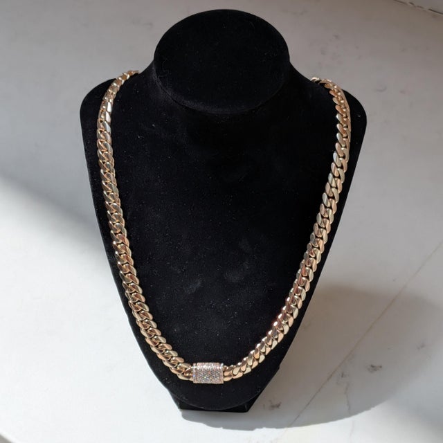Here is a 24in. 10mm wide 14k Yellow & Rose Gold Chain Necklace with ~0.9ctw of Round White Diamonds graded at I2 Clarity,...