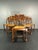Lovely set of 6 dining chairs wood turned legs with rush seats in the style of Charles Dudouyt. This set most likely is...