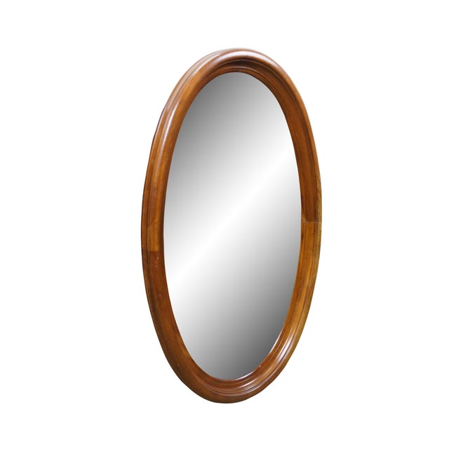 Long, oval, vintage wall mirror with beveled hardwood frame and beveled glass. Numbered 1118 on reverse. Dimensions: 22" x...