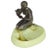 Made by Houzex, this brown and green slag ashtray features a spelter metal sculpture of a nude flapper girl smoking a long...