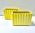 A vibrant pair of vintage ceramic planters featuring a bold sunny yellow glaze and sculptural fluted sides. The clean...