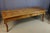 Large cherrywood dining table resting on four cabriole legs in the Louis XV style, early 19th century. It has two drawers...