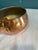 A beautifully aged vintage copper bowl with classic rounded silhouette and natural patina. This piece is perfect as a...