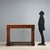 Empire console table in poplar veneered with walnut and crotchet, from Lombardy and dating to the early 19th century. The...