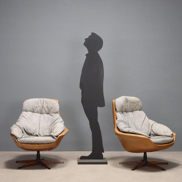 This pair of vintage armchairs from the 1970s represents an iconic example of period design, perfectly suited to spaces...