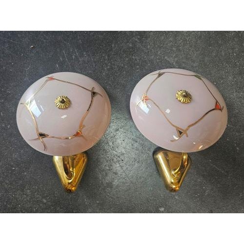 In this listing you will find a pair of very rare and extremely elegant sconces done in French gold plated bronze, with...