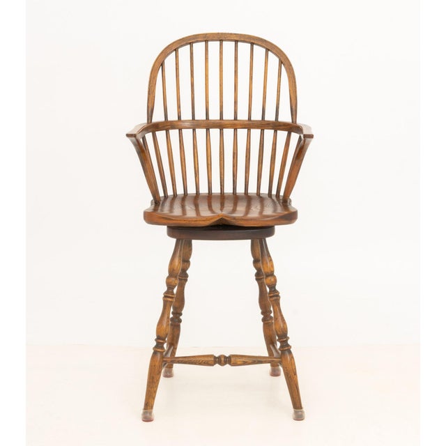 Windsor Style Oak Swivel Seat Bar Stool. 46.5" H x 22.75" W x 18" D; seat: 26" H. Provenance: From a Roxbury, Connecticut...