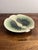 A sculptural 1970s porcelain orchid bowl by Oregon studio potters Alan and Brenda Newman. The organic botanical form is...