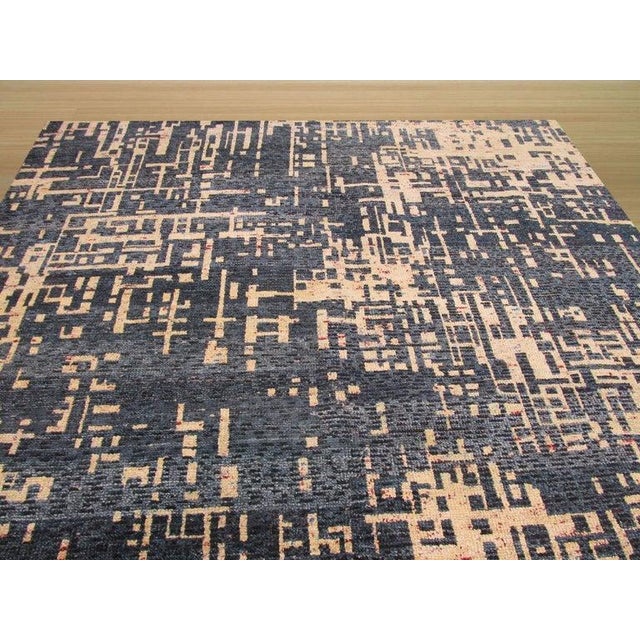 This hand knotted pile rug features a primary blue color and is constructed entirely from silk. As a distinct piece within...