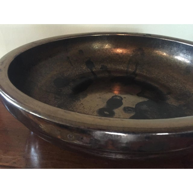 I've never seen another Gainey piece remotely similar to this, it's truly a mind blowing piece. The metallic base glaze...