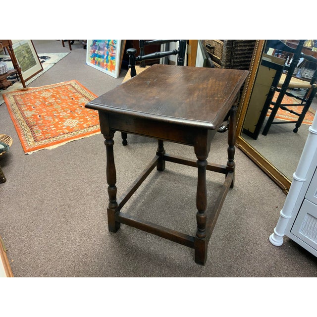 20th century oak table, with baluster legs and bottom stretchers all around base. Simple, functional design.