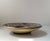 Dish or bowl by the danish ceramist Jørgen Mogensen. Stoneware with earthy brown sung glazes and with geometric relief...