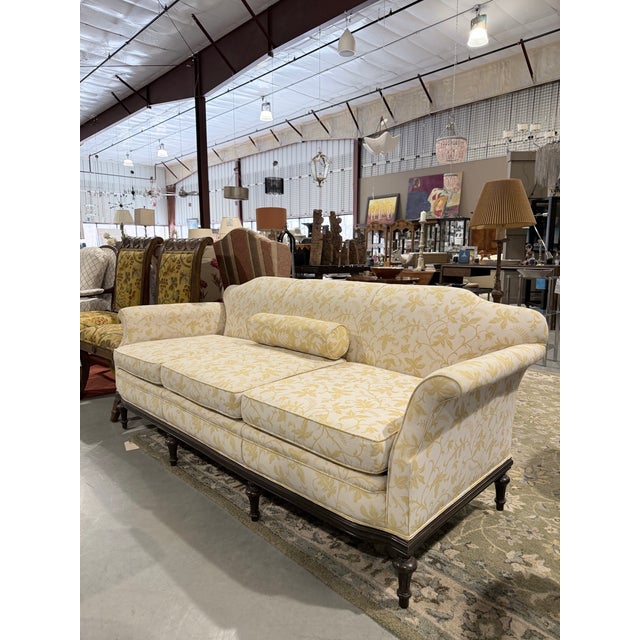 This is a charming vintage sofa by Yi’s, crafted in the United States and designed with timeless traditional appeal....