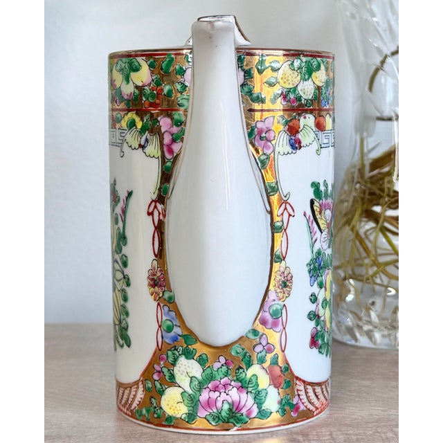 Vintage Lotus Bloom Famille Rose Canton-Guangcai Porcelain Teapot with Gilded Accents A beautiful vintage Chinese...